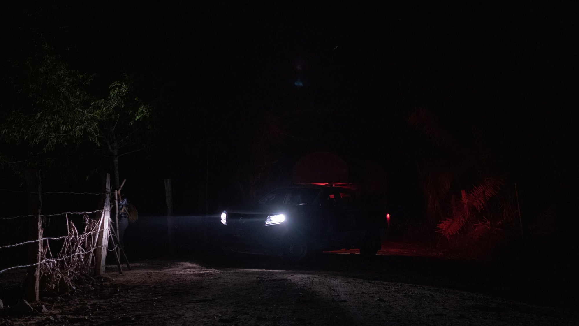 Car with high beams on at night.