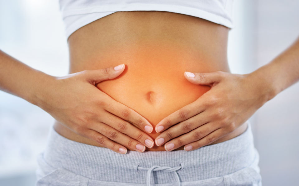 digestive health hands over stomach