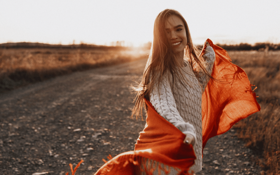 happy woman outside after taking lions mane mushrooms