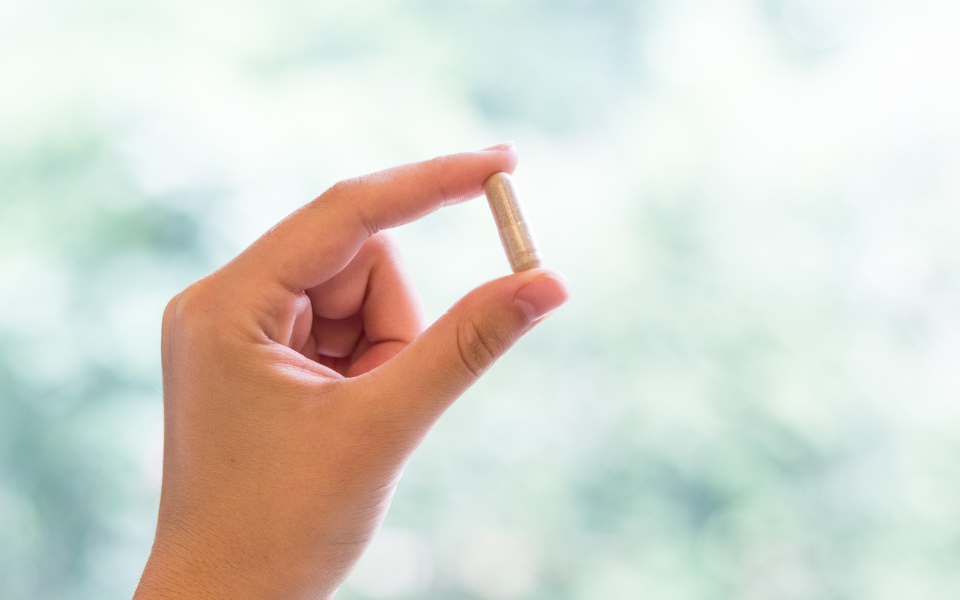 mushroom capsules in hand