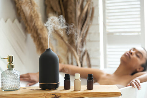 A lady having a bath with essential oil diffuser aromatherapy