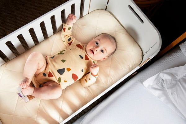 Surprised baby in Co Sleeping Crib