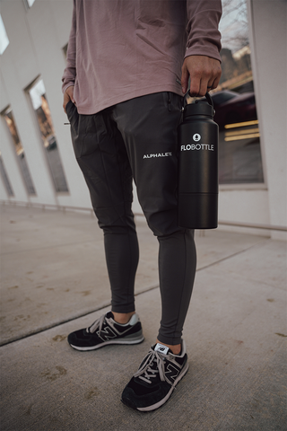 man holding stainless steel water bottle