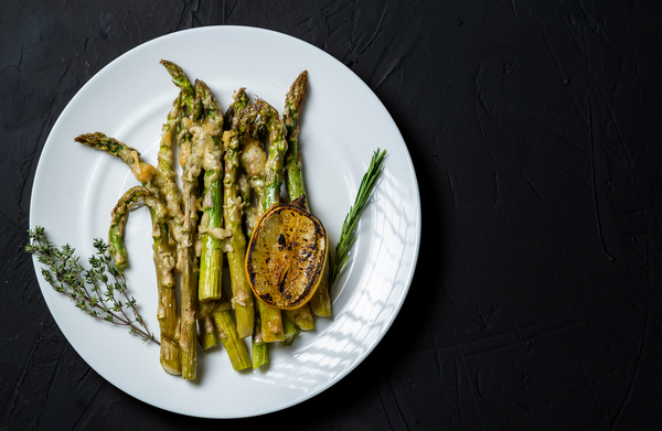 Grilled asparagus with lemon and parmesan cheese - a recipe from Landmann UK.