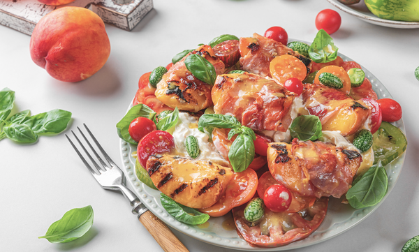 A delicious grilled peach, tomato and burrata cheese salad recipe from Landmann UK.