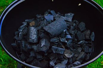 Simply take your charcoal and stack the individual pieces into a mound or pyramid. Ensure that you leave multiple gaps between the pieces.