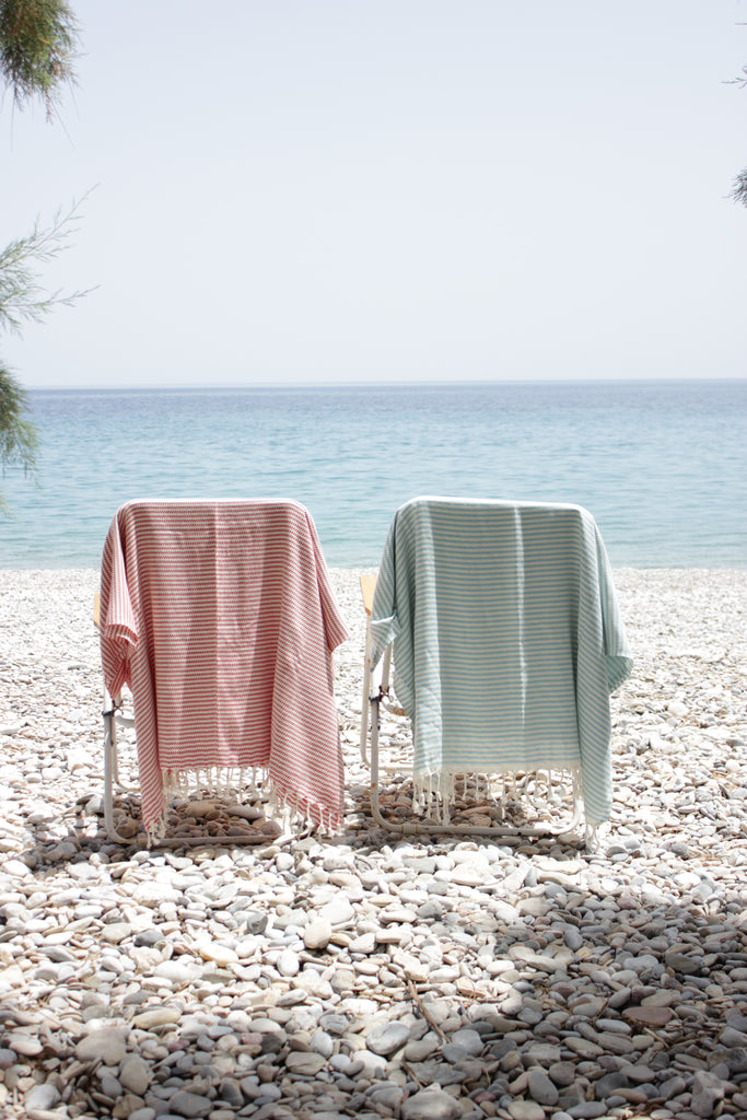 two towels on beach chairs