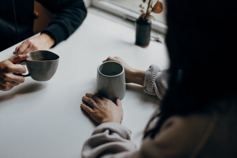 Two women having coffee together