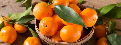 mandarins displayed in a basket