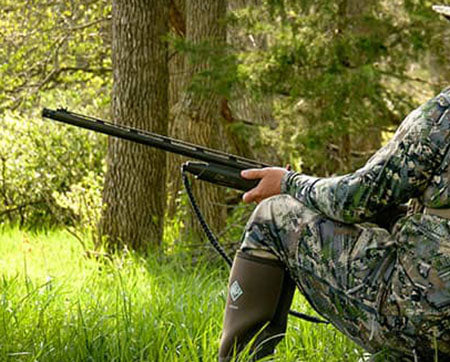 Turkey hunter holding a shotgun