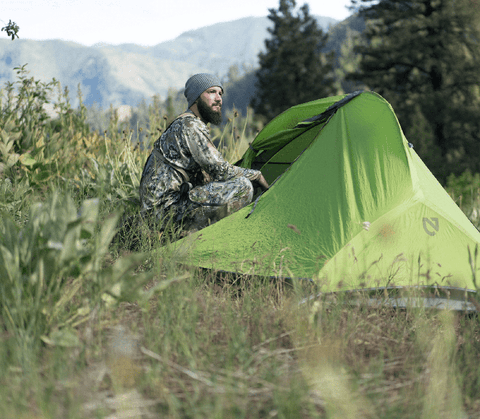 Man outside his tent