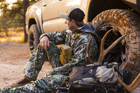 Man at truck with his hunting gear