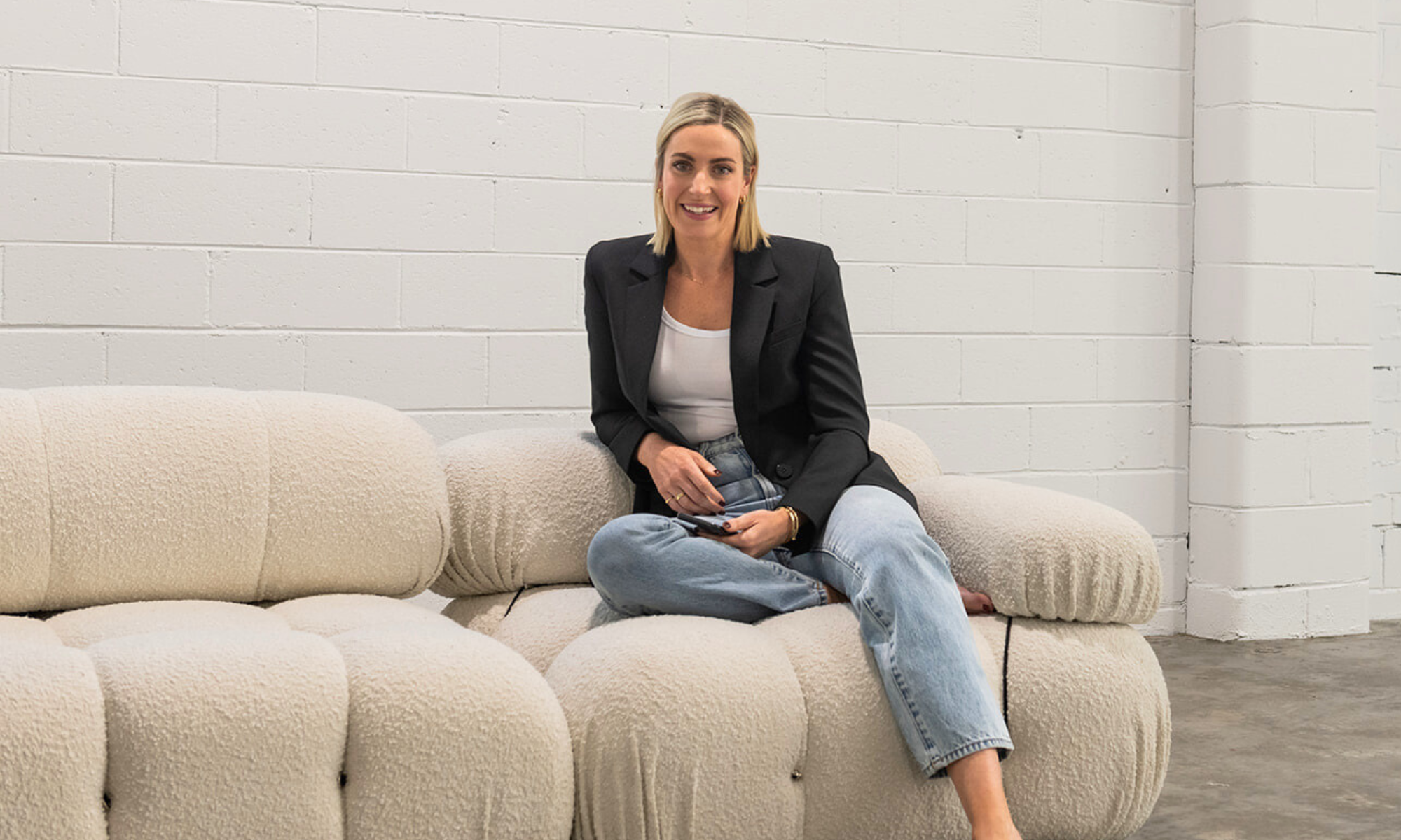 Kate Whelan, nutritionist, sitting on a couch