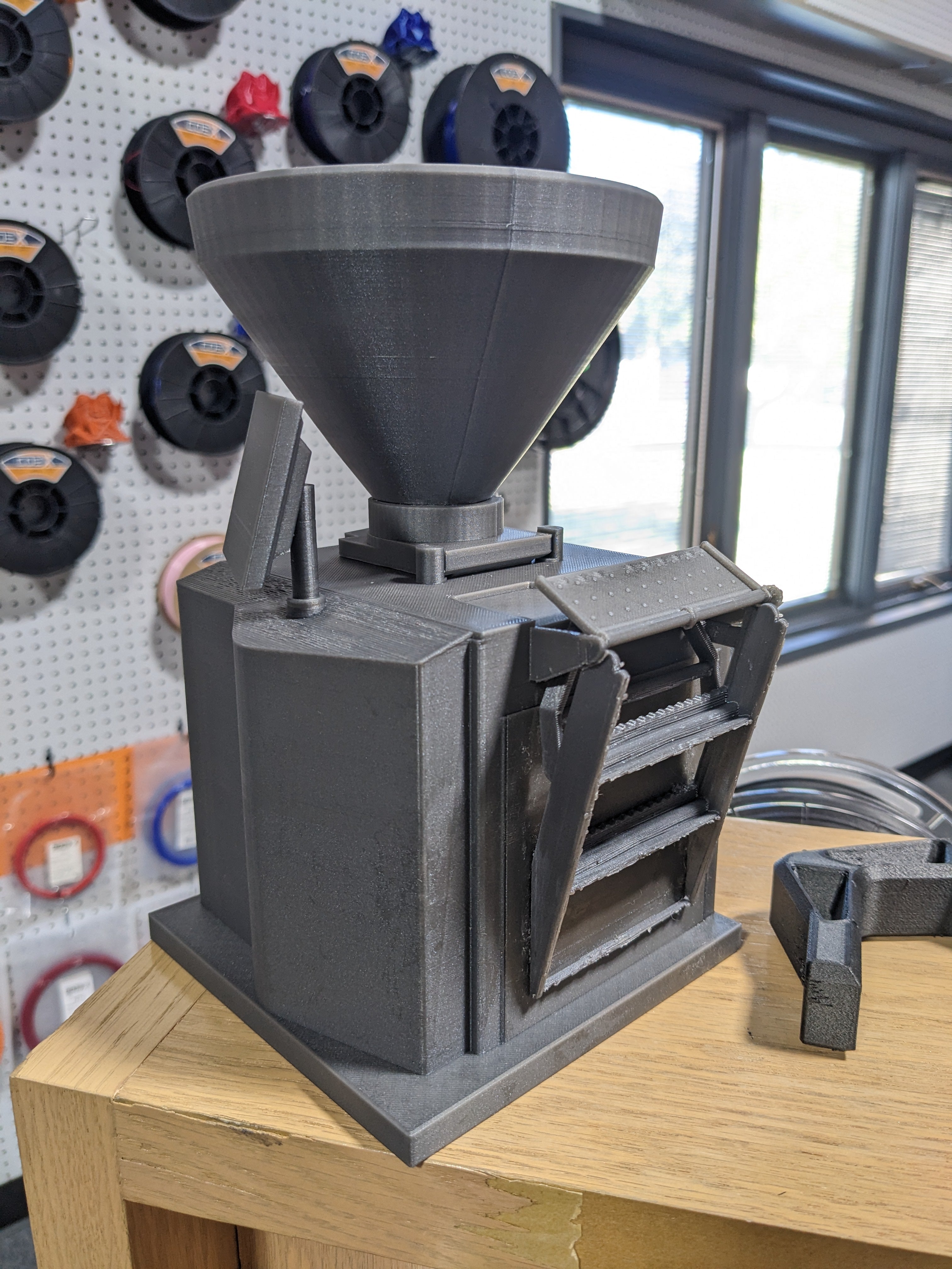 A small 3D printed model of a food processing machine