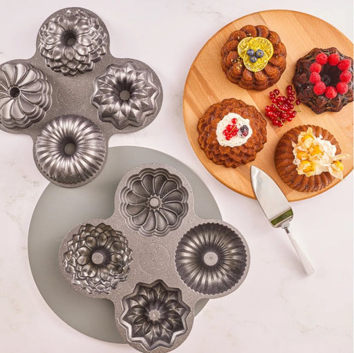 https://cdn.shopify.com/s/files/1/0603/2025/2142/products/emsan-griss-one-4-piece-cake-mold-104664_512x511.jpg?v=1693469050