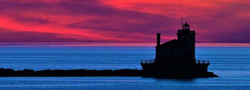 Michael Montgomery sunset lighthouse presented by H Lee White Maritime Museum near Oswego NY