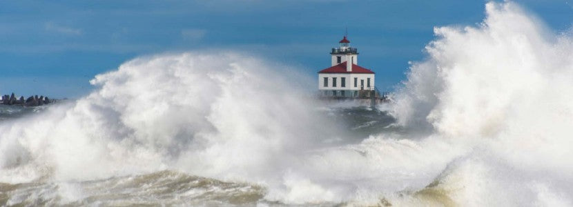  Wayne Kirby Lighthouse surrounded by rushing water presented by H Lee White Maritime Museum near Oswego NY