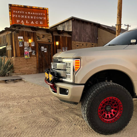 White Gold Ford F-250 parked out front of Papi & Harriets in Pioneer Town, Joshua Tree, CA. The Classic light bar by Factory Aftermarket