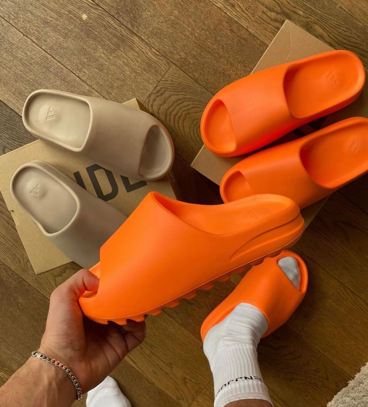 yeezy orange slides on feet