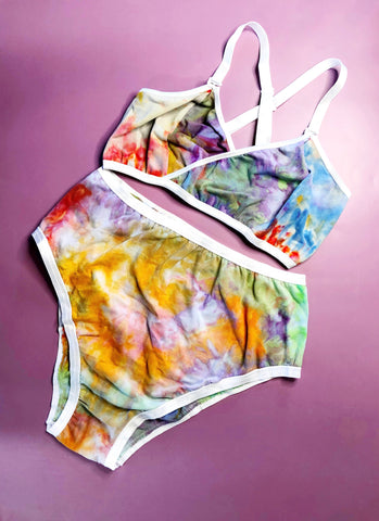ice dye wrap bralette and high rise undie on purple surface