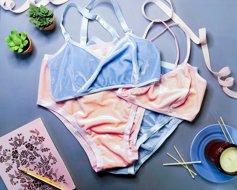 powder blue and baby pink lingerie on a blue background