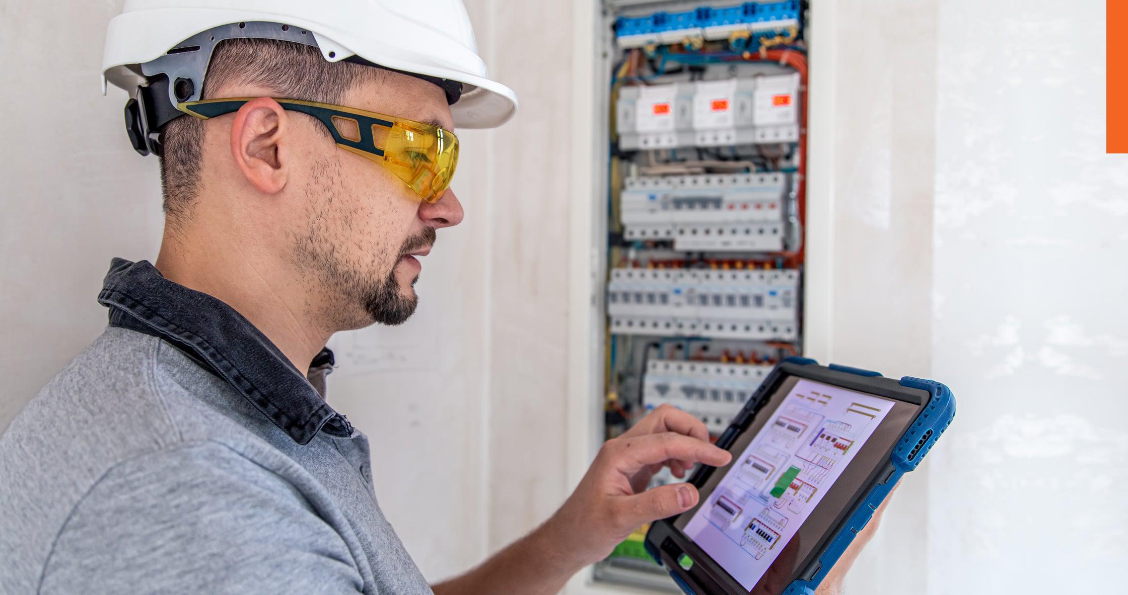 industrial electrician working on an electrical system