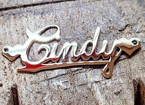 A custom name charm made by hand