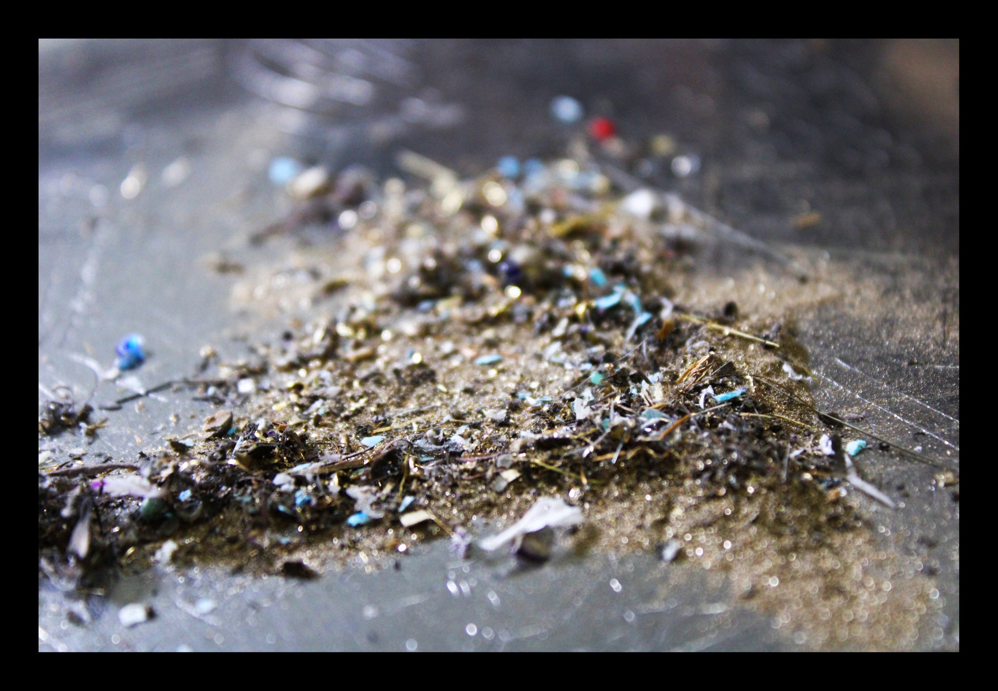 A pile of gold dust and scraps waiting to be refined