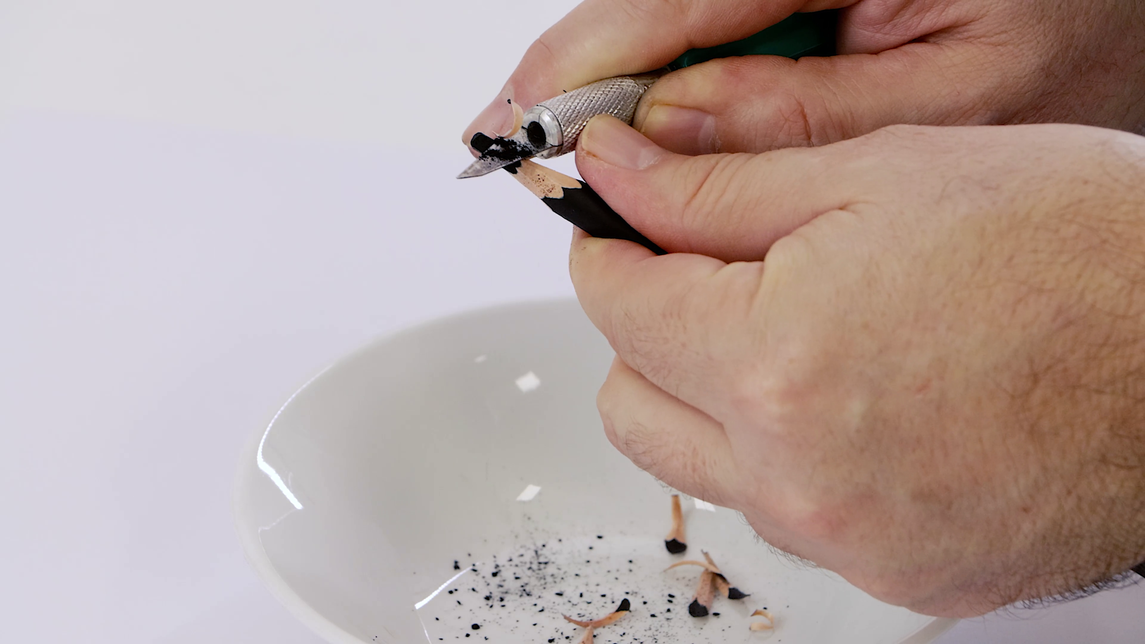 1. Precision Knife being used to sharpen a charcoal pencil