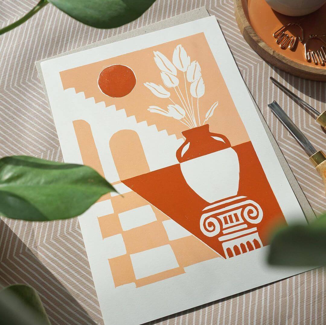 A Mediterranean linocut with a staircase, sun and vase in printed with rust and orange colours.