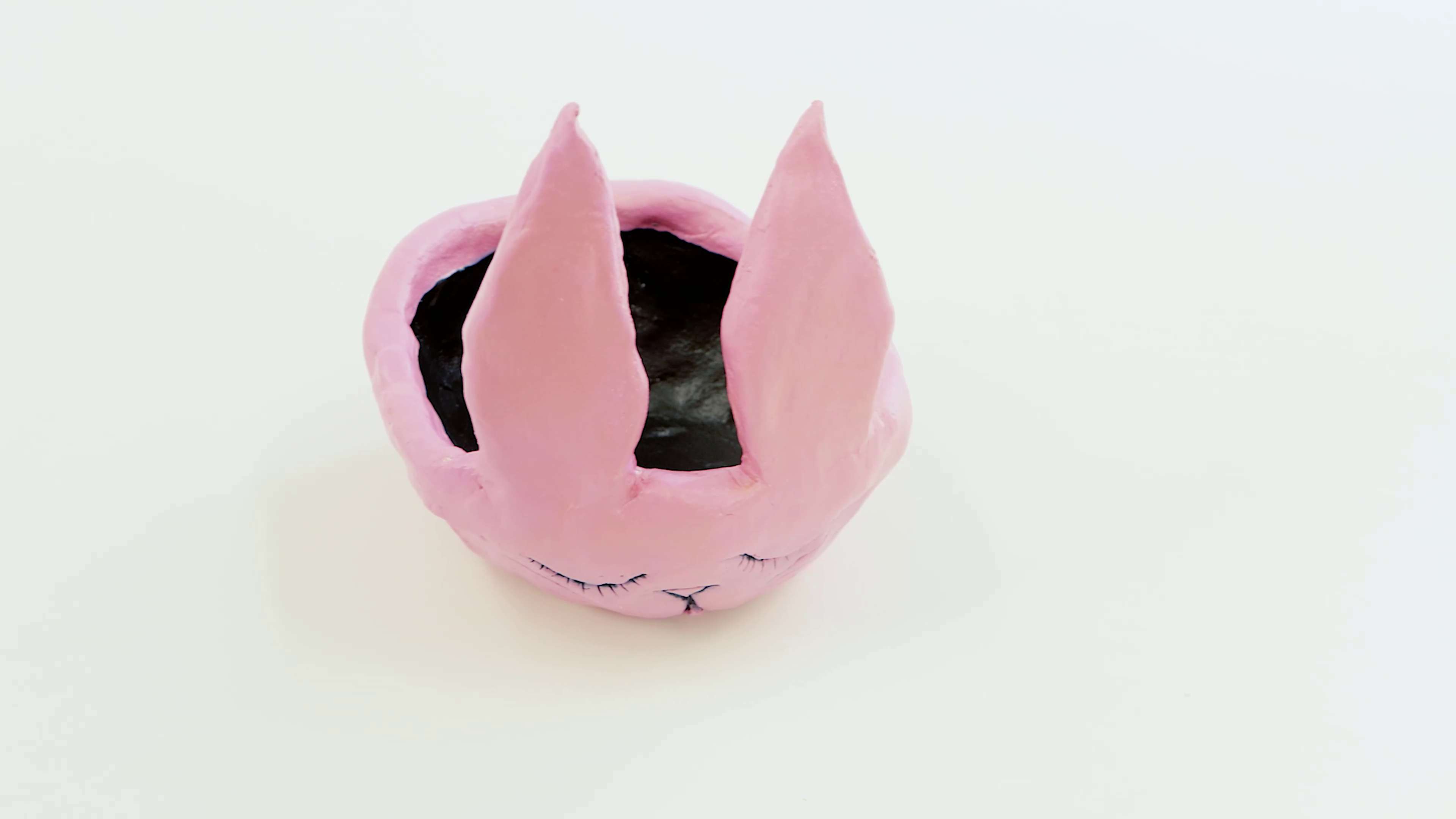 15. Pink rabbit Easter egg basket made from polymer clay.