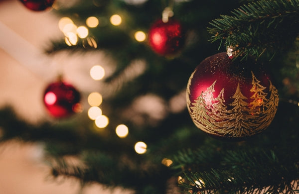 Illustrated baubles on a Christmas tree.