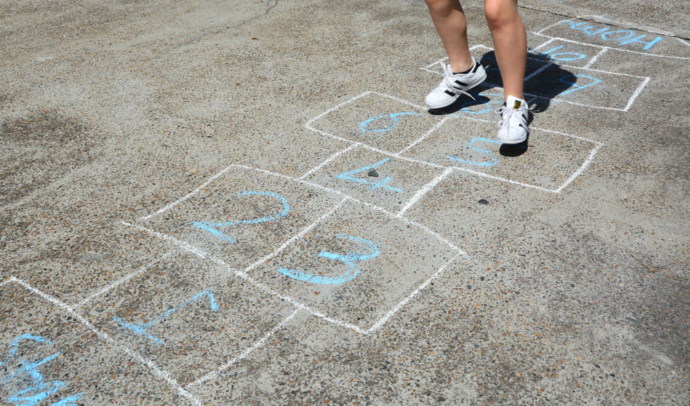 Feet playing hop scotch.