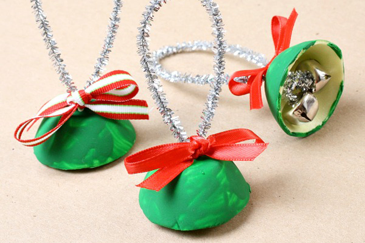 Three recycled egg cartons made to look like Christmas bells.
