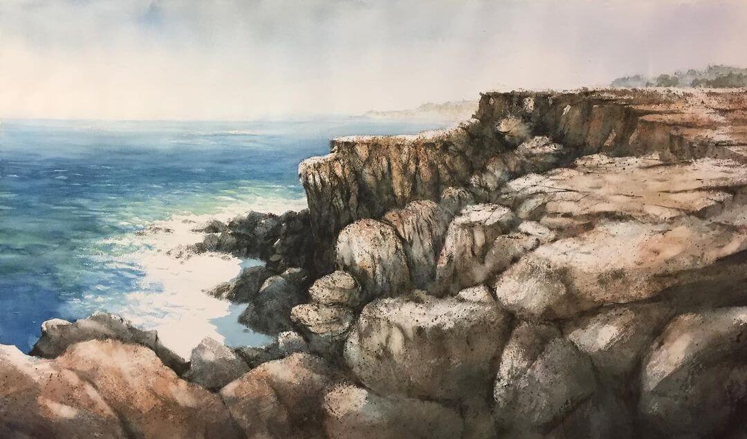 A nature water colour painting of a beach scape with cliff rocks.