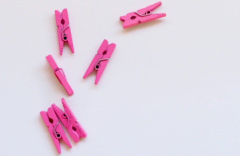 Hot pink painted pegs.