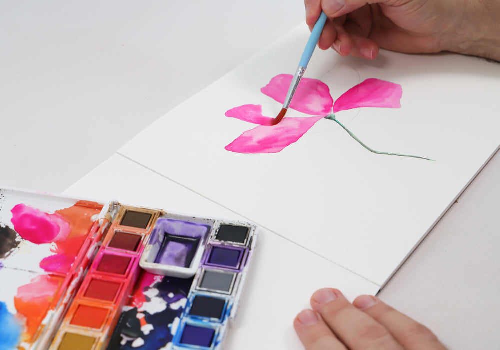 Hand drawing a watercolour flower.