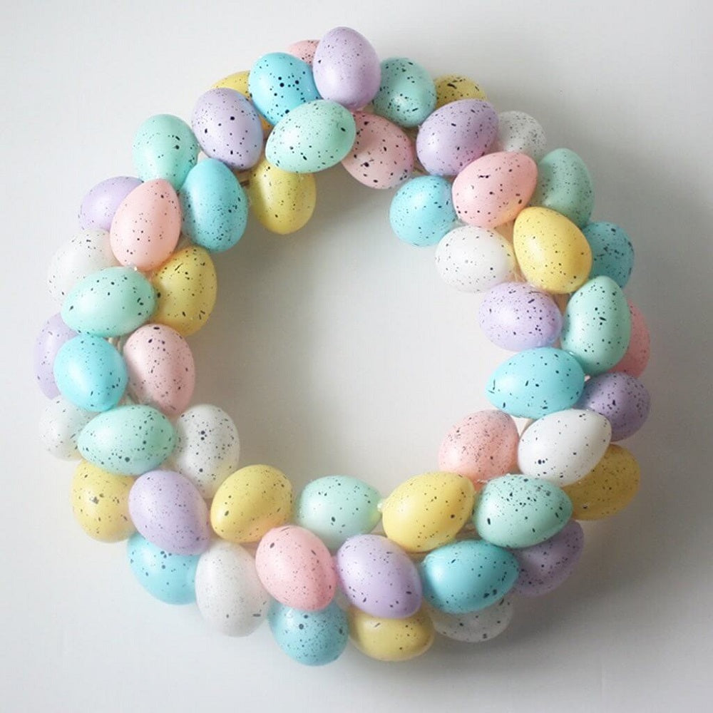 A pastel Easter wreath made from speckled plastic eggs.