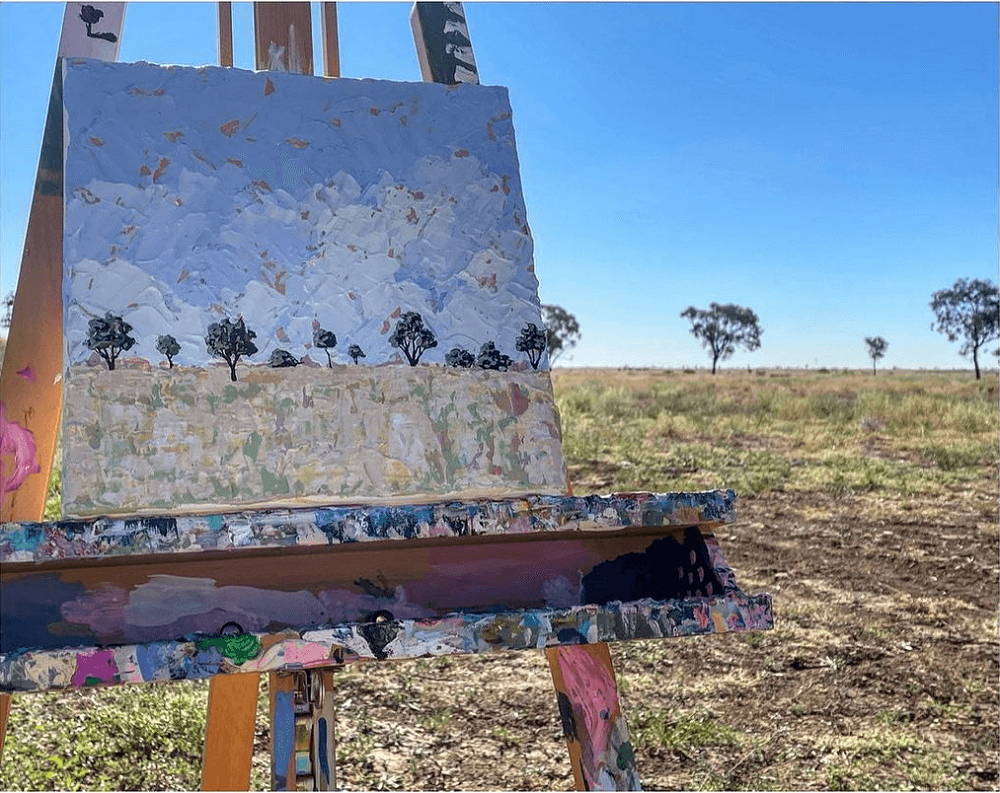 An abstract landscape on a canvas standing on a rural Australian property.