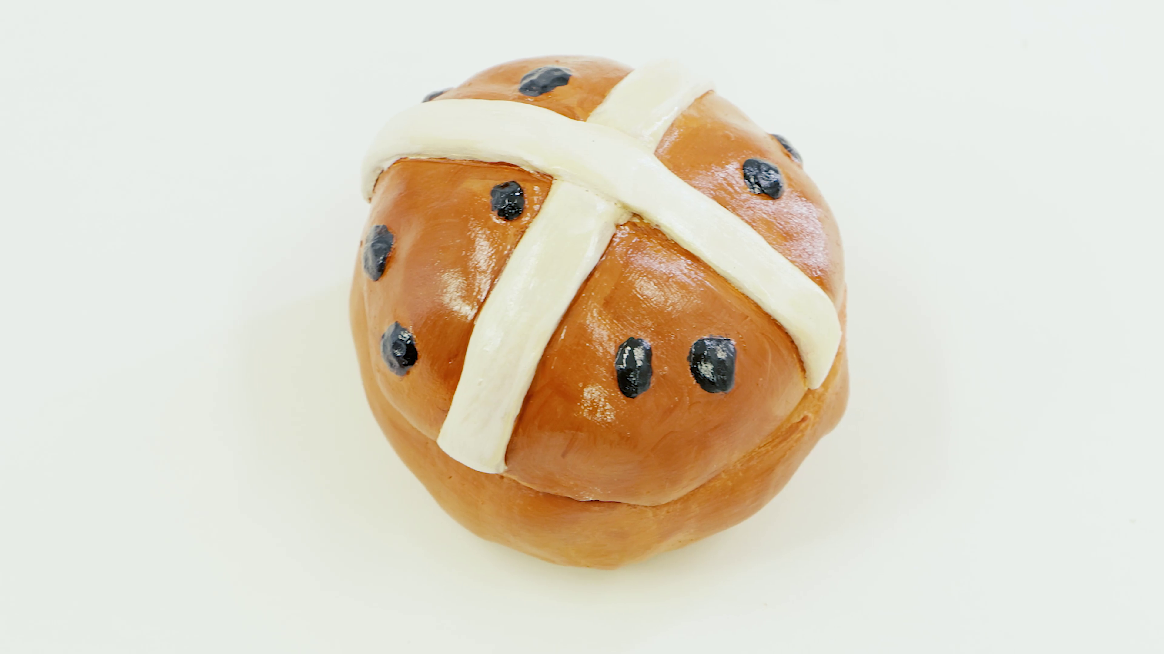 Hot cross bun trinket tray made from polymer clay.