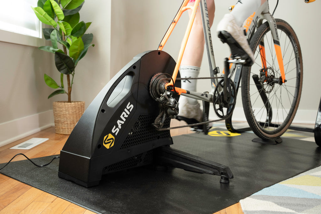 man riding h3 plus indoor bike trainer