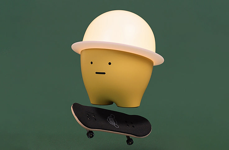 Chubby Night Light on a skateboard, highlighting its playful and portable design​