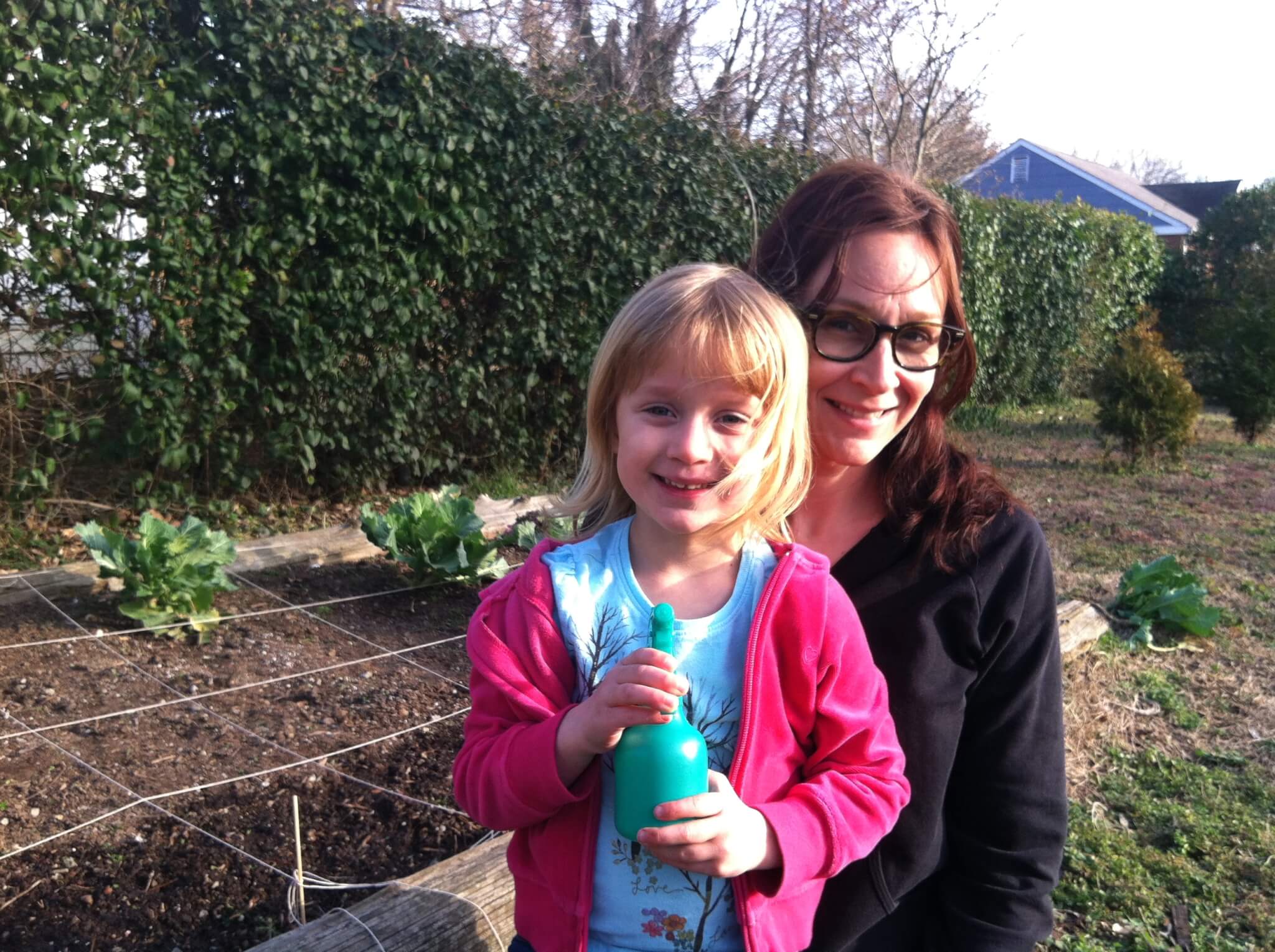 the author and her daughter by the garden