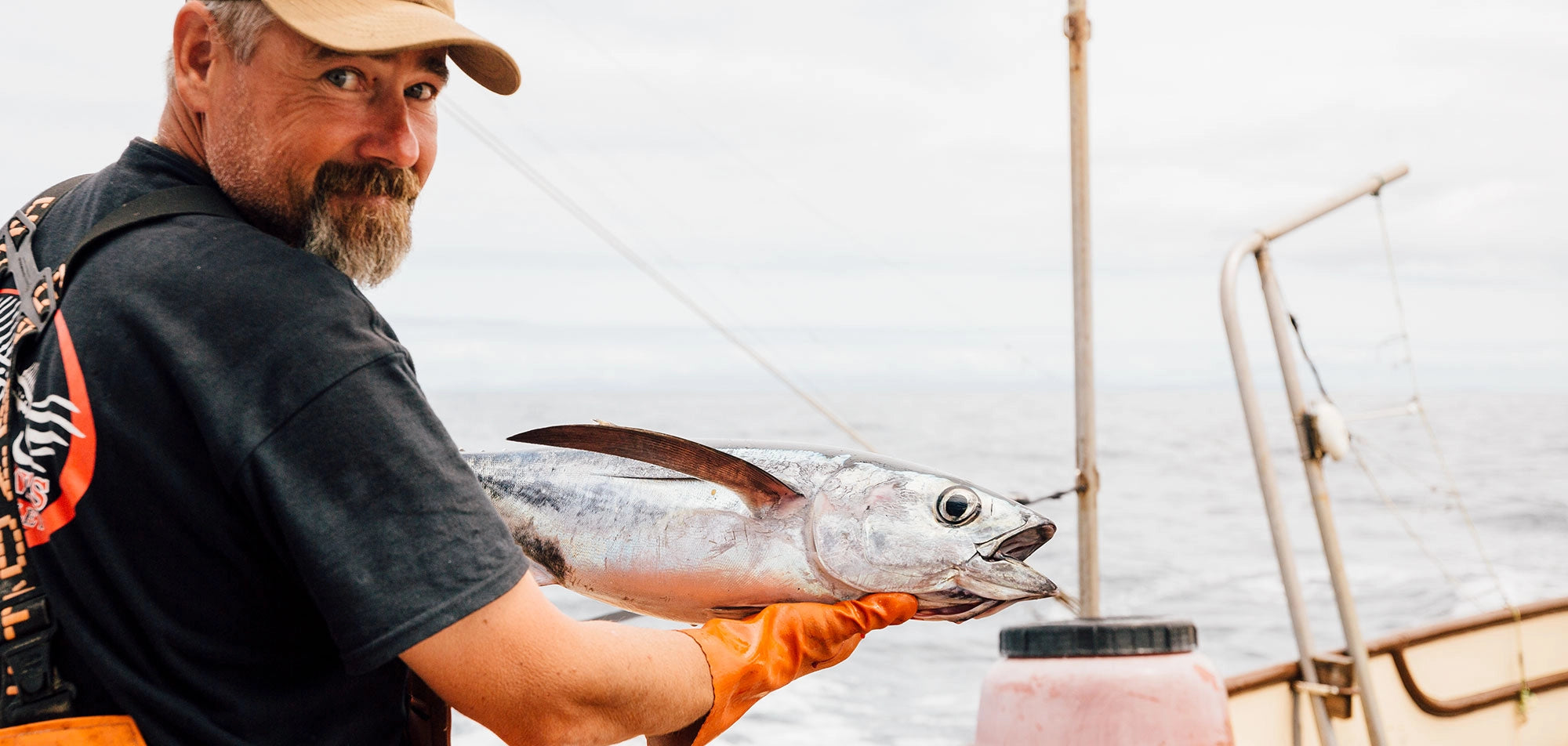 Fisherman holding tuna