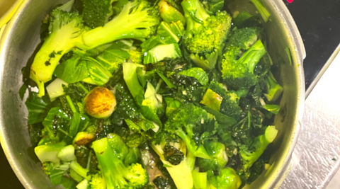 pan of mixed greens seasoned with Spring Zing organic spice blend