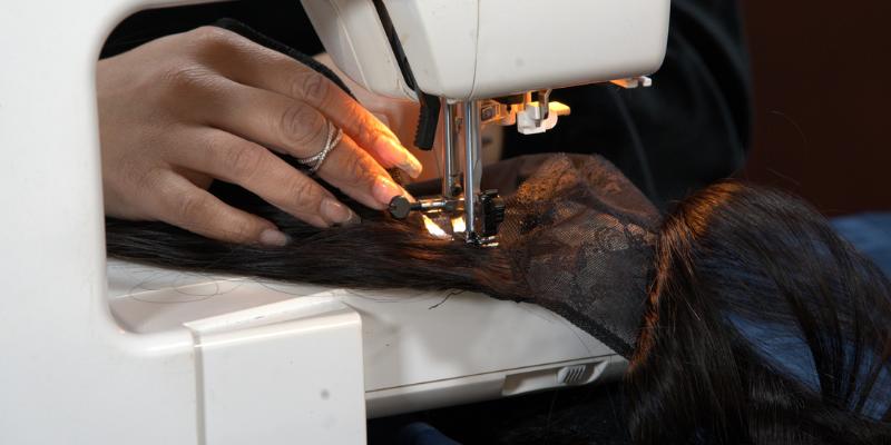 hairstylist making custom wigs