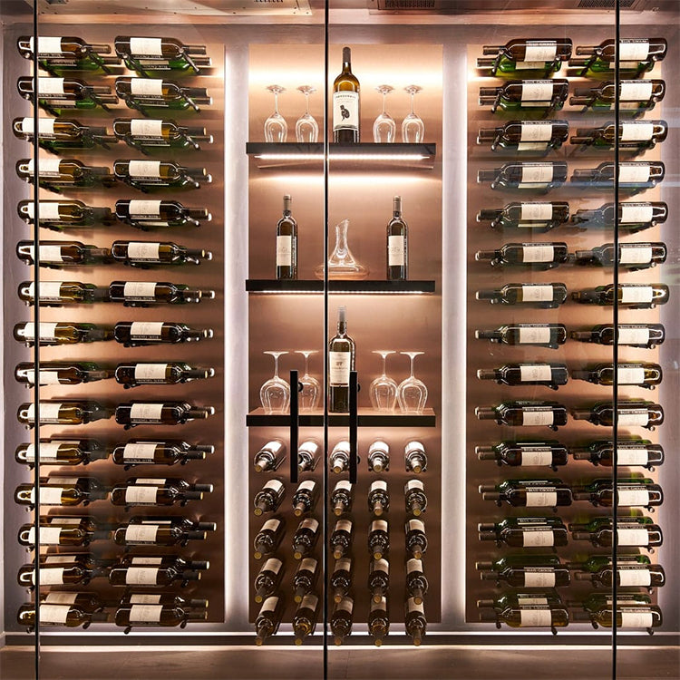 wine bottles resting on black wine pegs inside a glass display case