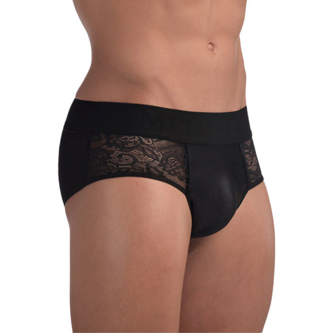 a white, hairless, muscled, masculine looking torso cropped above the knee and below the chest, wairing black lacey briefs with sheer panels on either side of the center crotch panel