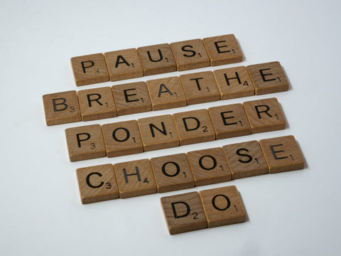 scrabble tiles reading pause, breathe, ponder, choose, do