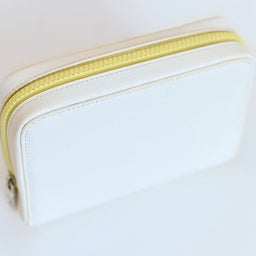 white and yellow bag insulated designer fancy and not just a snacker a cosmetic bag